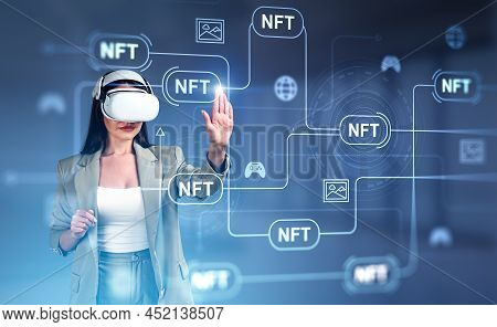 Businesswoman In Formal Wear And Vr Helmet Is Touching Digital Interface With Non-fungible Token Hol