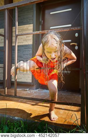 Happy Funny Little Blone Girl With Wet Hair After Rain In A Summer Or Spring Day