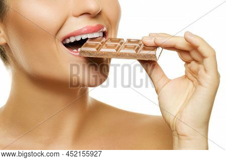 Female Mouth And Chocolate Bar On White