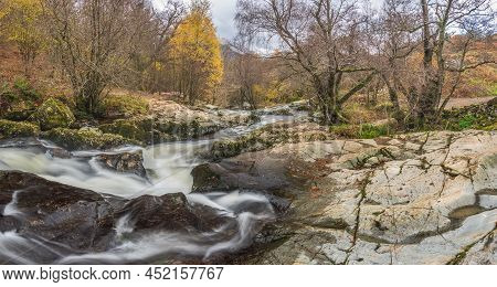 Epic Landscape Image Of Aira Force Upper Falls In Lake District During Colorful Autumn Showing