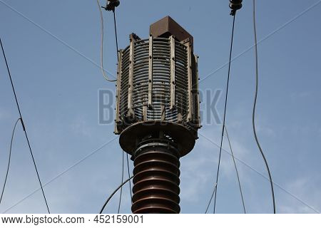 Power Station. Transmission Towers To Provide Energy To A Residential Area. Steel Structures For Gen