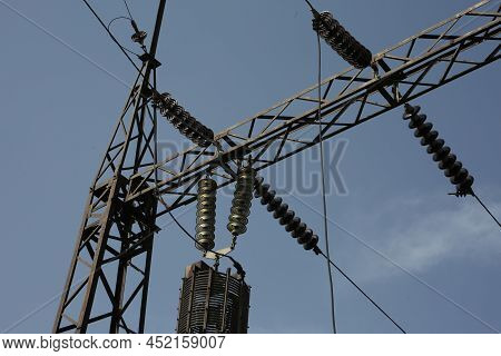 Power Station. Transmission Towers To Provide Energy To A Residential Area. Steel Structures For Gen
