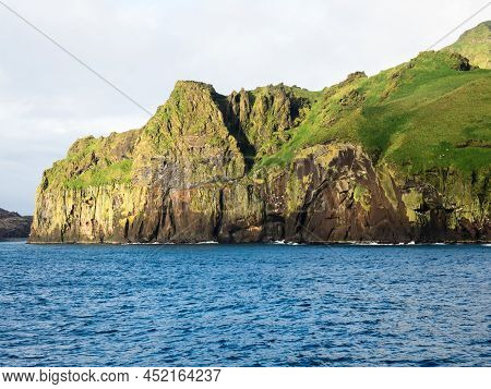 Dramatic Cliffs At The Entrance To Heimaey Harbour On Westman Islands, Iceland