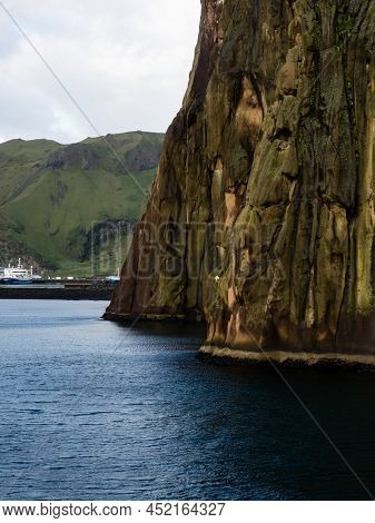 Dramatic Cliffs At The Entrance To Heimaey Harbour On Westman Islands, Iceland