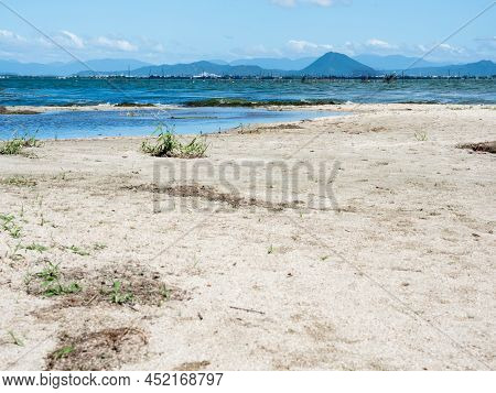 Scenic View From The Shores Of Lake Biwa At Sakamoto Castle Ruins Park In Otsu, Japan
