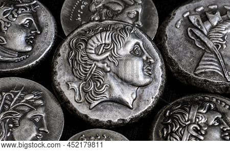 Ancient Greek Coins Close-up, Portrait Of Alexander The Great In Center, Silver Tetradrachm Coins. C