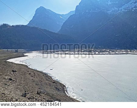 Frozen Klöntalersee Or Klontaler Lake During Early Spring In The Alpine Valley Klöntal (kloental Or 
