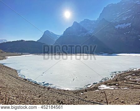 Frozen Klöntalersee Or Klontaler Lake During Early Spring In The Alpine Valley Klöntal (kloental Or 