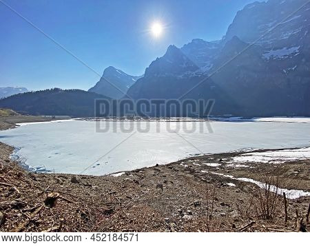 Frozen Klöntalersee Or Klontaler Lake During Early Spring In The Alpine Valley Klöntal (kloental Or 