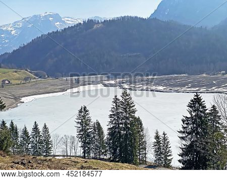 Frozen Klöntalersee Or Klontaler Lake During Early Spring In The Alpine Valley Klöntal (kloental Or 