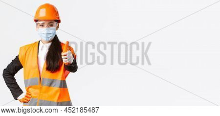 Covid-19 Safety Protocol At Enterpise, Construction And Preventing Virus Concept. Confident Asian Fe