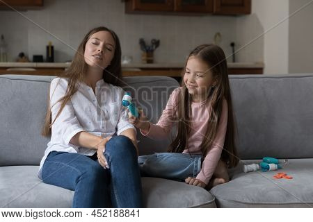 Curious Daughter Girl And Loving Mom Playing Doctor And Patient