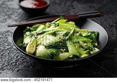 Chinese Fried Pak Choi With Garlic, Sesame Seeds. Healthy Food