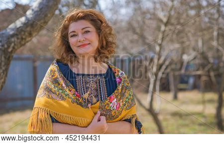 European Plus Size Ethnic Woman In Embroidery Traditional Shirt And Scarf. Concept Of National Costu