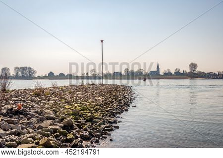 Groyne Of Basalt Blocks In The Wide Dutch River Waal. The Photo Was Taken Near The Village Of Vuren,