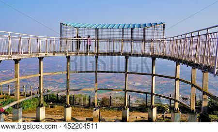 Tourist Enjoying Beautiful View From Top Of Nandi Hills