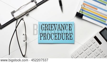 Stickers With Chart,calculator And Paper With Text Grievance Procedure On White Background