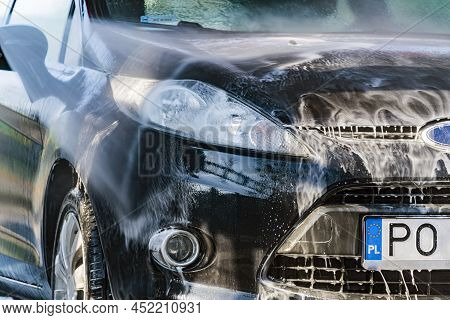 A Vehicle In A Coin-operated Self-service Car Wash