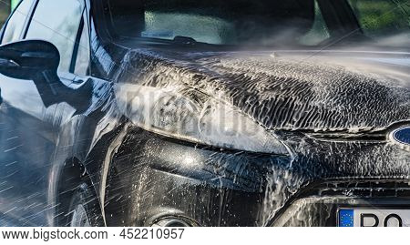 A Vehicle In A Coin-operated Self-service Car Wash