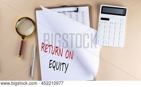 Clipboard With Chart And Text Return On Equity With Magnifier ,calculator On A Beige Background
