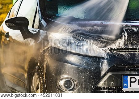 A Vehicle In A Coin-operated Self-service Car Wash