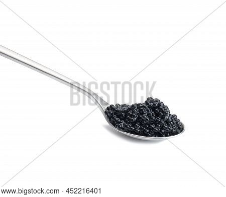 Black Paddlefish Caviar In A Metal Spoon On A White Isolated Background