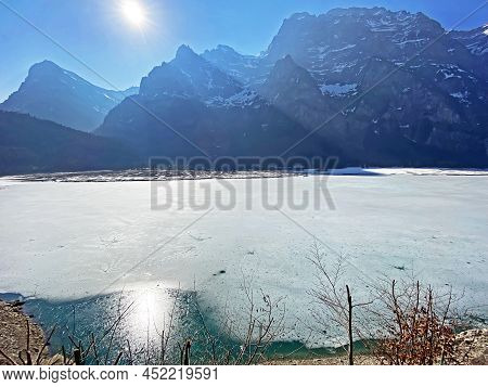 Thawing A Frozen Lake Klöntalersee Or Klontaler Lake During Early Spring In The Alpine Valley Klönta