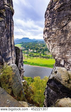 The magnificent German river Elbe. The sandy cliffs of Bastei, 200 meters high above the Elbe River, are a famous attraction. Artists' road Malerweg in Saxon Switzerland.