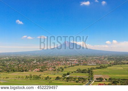 Aerial View Of Mount Merapi Landscape With Rice Field And Village In Yogyakarta, Indonesia Volcano L