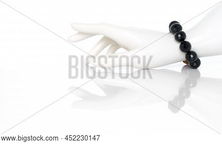 Black Spinel Bracelet On Plastic Mannequin Female Hand. Collection Of Natural Gemstones Accessories.
