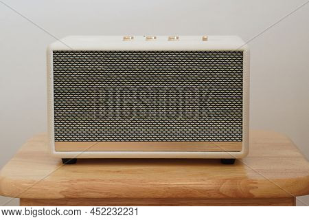 Front View White And Gold Loudspeaker On Wooden Chair, White Wall Background, Technology, Object, Fa