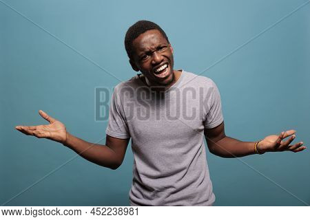 Upset Man Doing I Dont Know Symbol In Front Of Camera, Expressing Confusion And Being Unsure About D