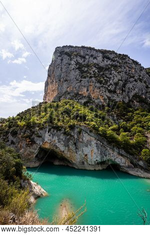 Deep Turquoise River At The Bottom Of A Vertical Canyon