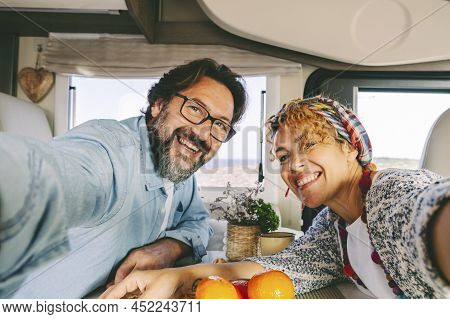 Happy And Cheerful Confident Man And Woman Couple Smile And Have Fun Taking Selfie Picture Inside A 