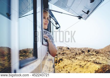 Nice Adult Woman Smile And Enjoy Freedom At The Natural Campsite Admiring Outdoors Outside The Windo