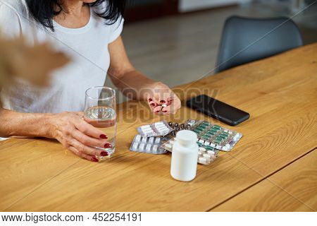 Senior Woman Take Daily Vitamins, Beauty Supplements