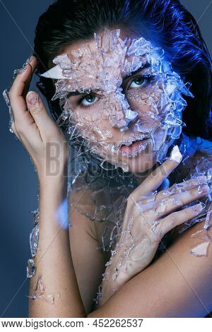 Female Face Covered With A Small Pieces Of Glass