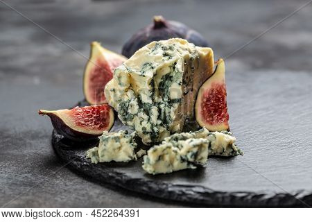 Blue Cheese And Sweet Fruit Figs. Blue Cheese Gorgonzola Picante With Blue Mold From North Of Italy.