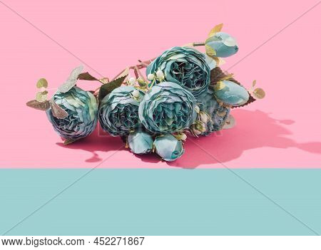 Teal Peonia Artificial Flowers Bouquet On A Two Tone Pastel Background. Springtime Minimal Concept.