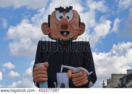 Landerneau, France - April 03 2022: Gargamel Throning On Top Of A Smurfs Themed Parade Float Of The 