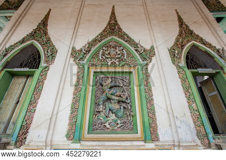 Picturesque Exterior Of The Ancient Buddhist Temple, The Stucco Tracery Of Narayana Bends His Bow On