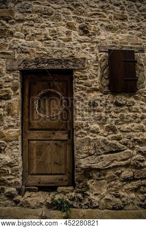 An Old Wooden Door In Poffabro, An Historic Medieval Village In The Val Colvera Valley In Pordenone 