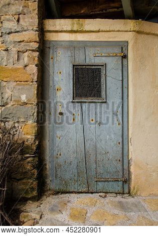 An Old Wooden Door In Poffabro, An Historic Medieval Village In The Val Colvera Valley In Pordenone 