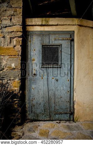 An Old Wooden Door In Poffabro, An Historic Medieval Village In The Val Colvera Valley In Pordenone 