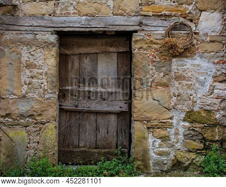 An Old Wooden Door In A Derelict House In Poffabro, An Historic Medieval Village In The Val Colvera 