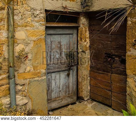Old Wooden Doors In Poffabro, An Historic Medieval Village In The Val Colvera Valley In Pordenone Pr