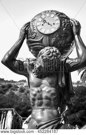 Guardamar, Alicante, Spain- April 3, 2022: Wooden Atlas Clock For Sale At An Antiques Flea Market Ca