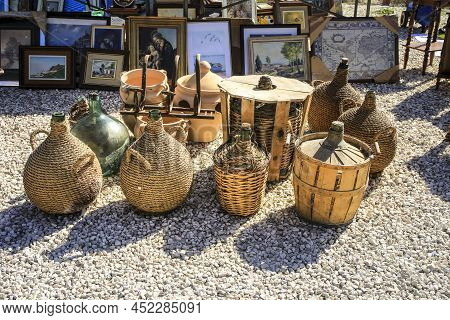 Guardamar, Alicante, Spain- April 3, 2022: Glass Carafes Covered With Raffia For Sale At El Fogon An
