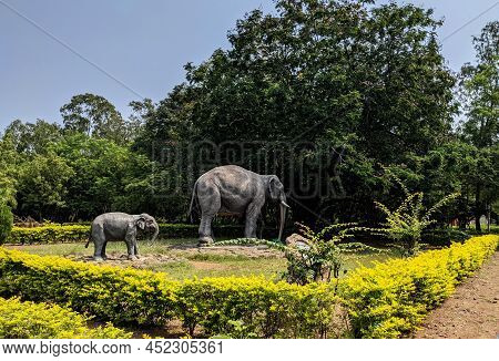 Side View Of Elephants Family Cement Sculptures In Gulbarga University Garden: Kalaburagi, Karnataka