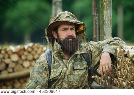 Portrait Of Adventure Serious Man Extreme Explorer. Man Hunter In Camouflage Outdoor. Brutal Hunter,